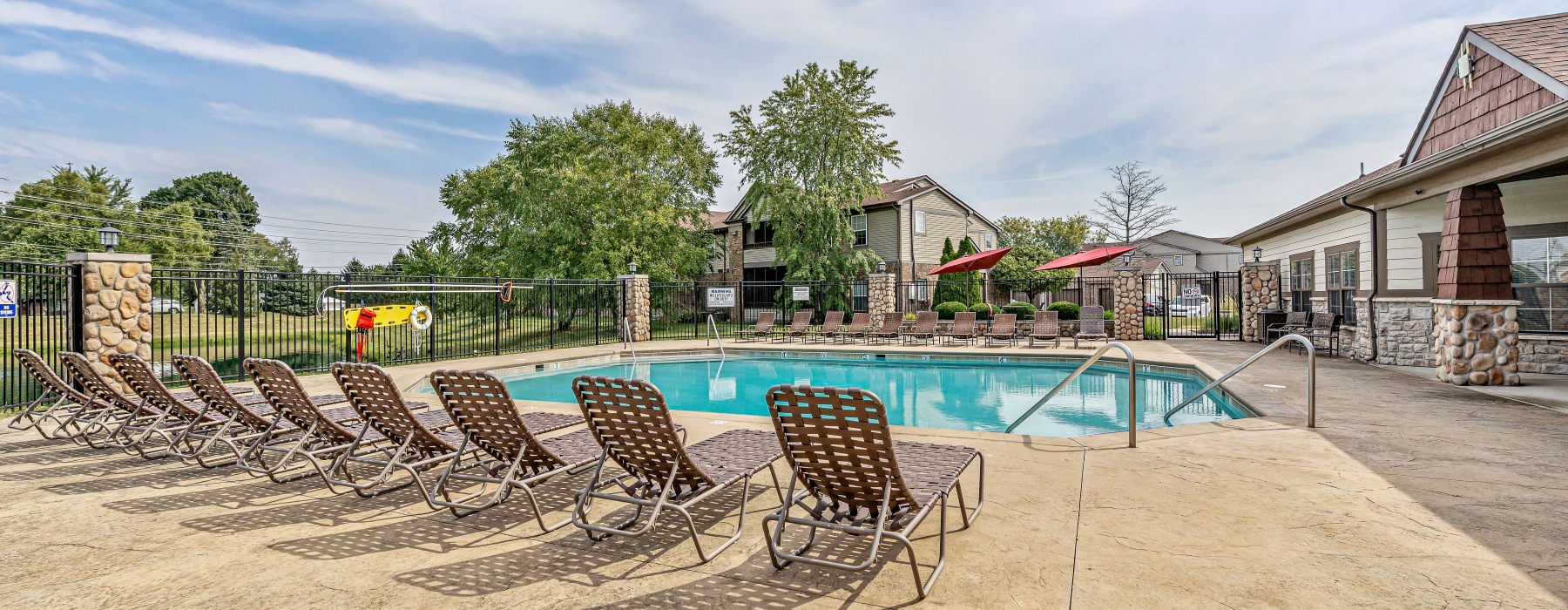 swimming pool with lounge chairs