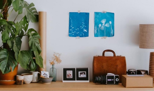 large dresser with a variety of decor on it